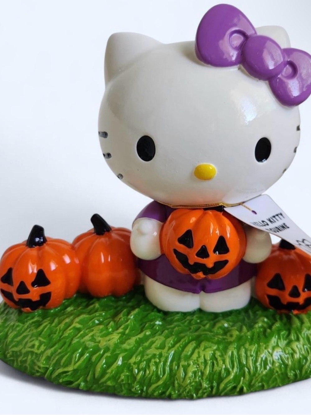 Hello Kitty Purple Outfit Figure with Orange Jack-O'-Lanterns